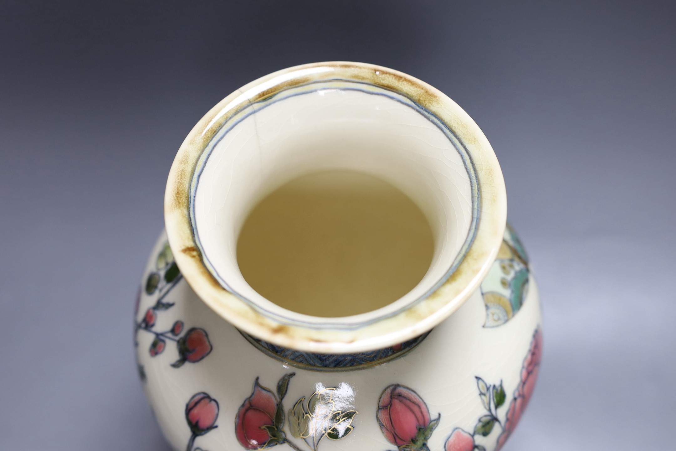 An early 20th century Zsolnay Persian style pottery vase. 26cm tall